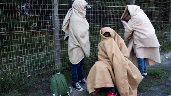Calais `Jungle` stragglers and minors spend another night at camp